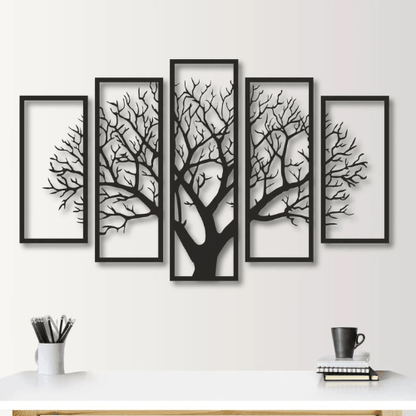 Set of five framed black tree silhouettes on a white wall