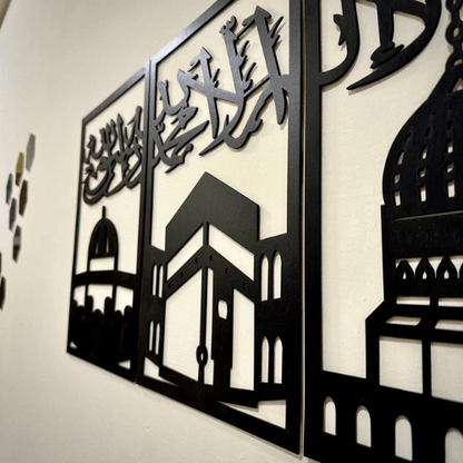 Decorative metal wall art with architectural silhouettes on a white background